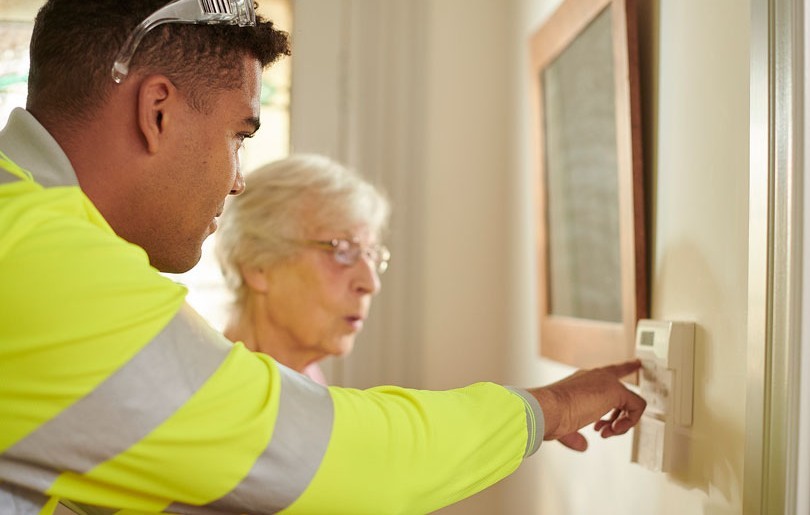 An electrician from Electricity North West supporting a vulnerable lady in her home